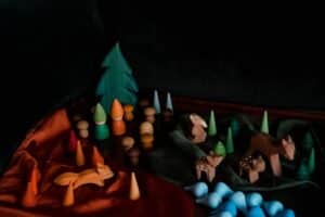 A small world play scene with wooden animals