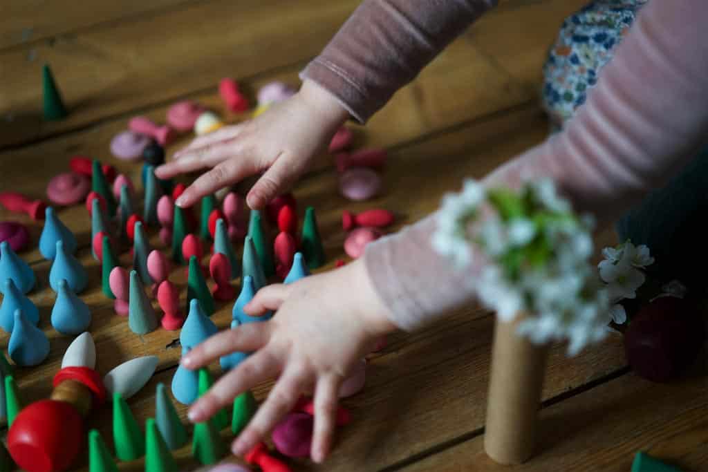 A child playing with loose parts