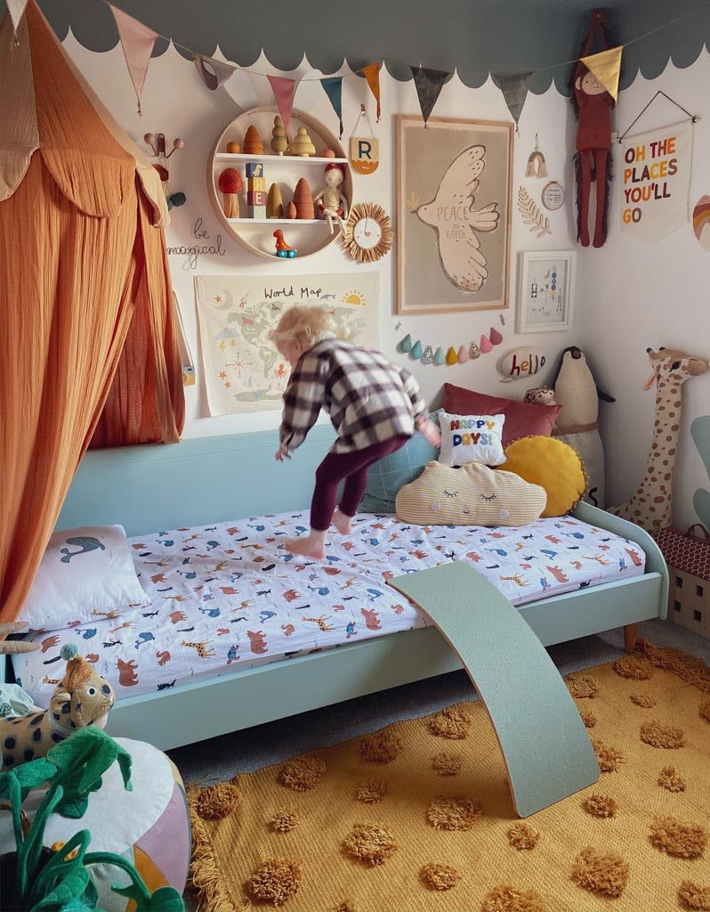 A boy jumping on a bed - a great way to improve balance