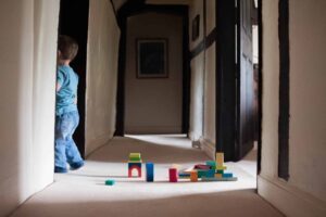 A child playing alone with blocks