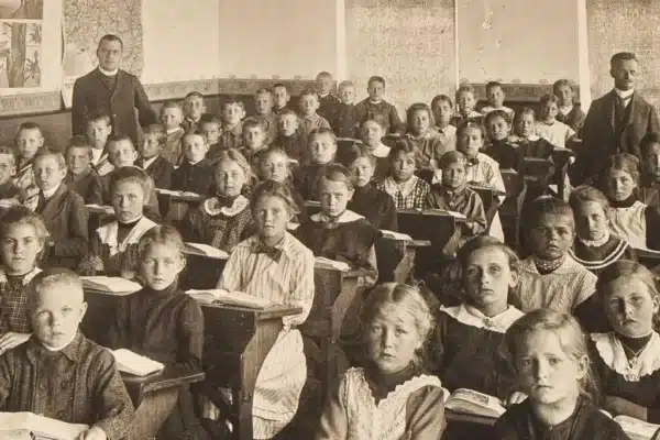 Victorian children sitting attentively in class